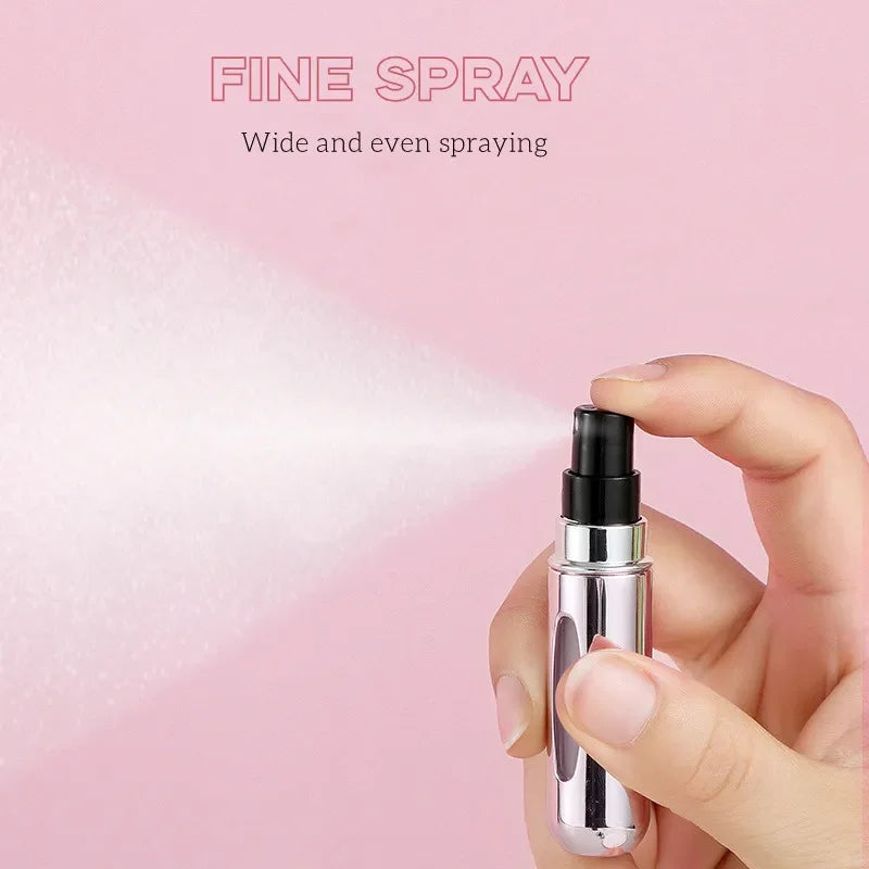 A hand holds a silver fine spray perfume bottle, demonstrating wide and even spraying.