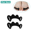 A pair of black silicone toe separators shown with a close-up of their use on a foot.