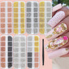 A collection of gold mixed stainless steel bead nail art decorations displayed on various clear acrylic plates and applied to