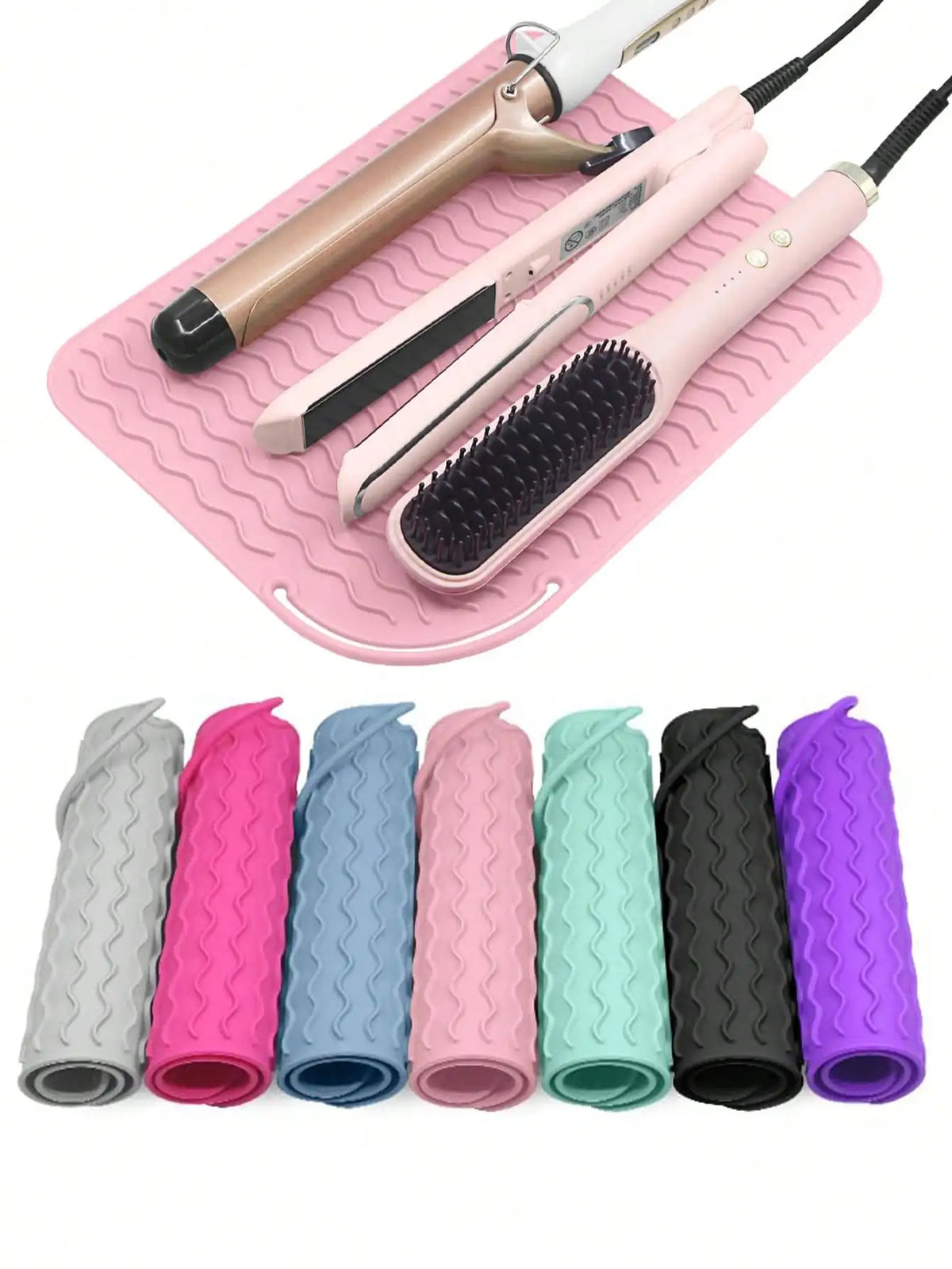 A pink silicone mat holds various hair styling tools including a curling iron and a brush with different colored silicone hai