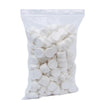 A clear plastic bag filled with white reusable compressed face towels.