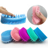 Collection de gants de douche en silicone à double face de différentes couleurs : bleu, rose, violet et sarcelle.