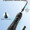 A black portable oral irrigator with an ergonomic handle design showing features like a release jet button and easy handling.