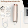A rechargeable and portable facial shaver with a cylindrical body and a charging cable connected to a power adapter.