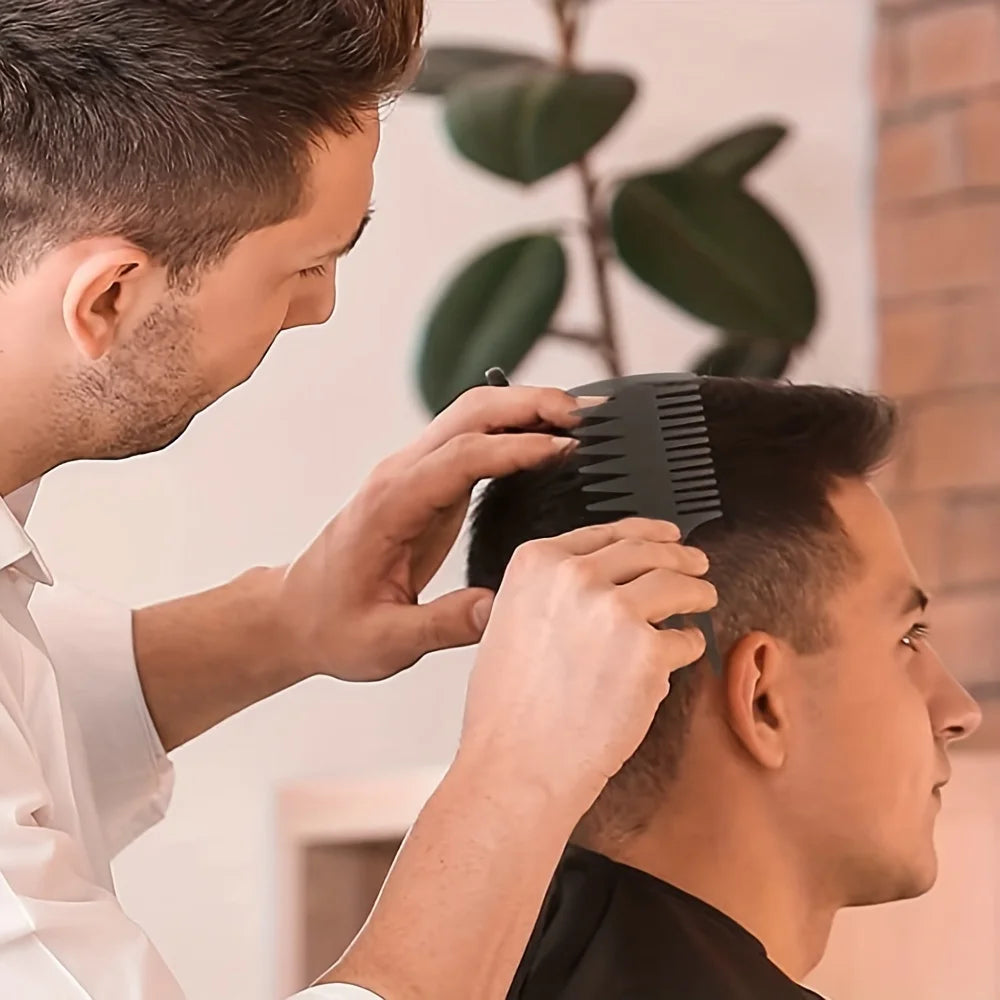 A man is using a black comb to style or detangle his hair.