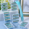 A turquoise precision safety razor with a handle and six layers of stainless steel blades is displayed in clear plastic stora