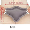 Grey lumbar molder compression support board shown being held against a light-colored fabric.