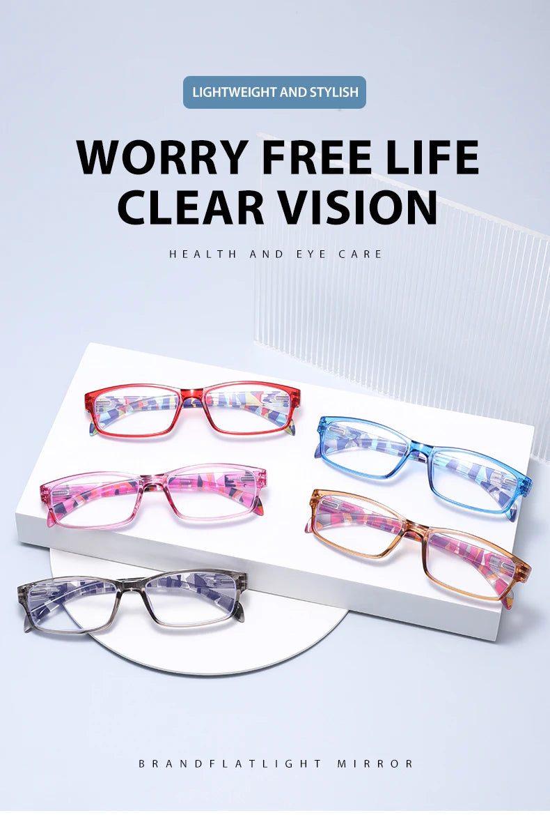 Una exhibición de cinco pares de gafas de lectura anti-luz azul elegantes en varios colores y monturas.