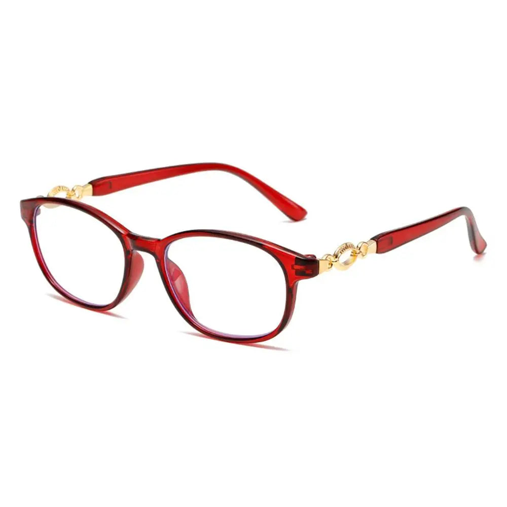 A pair of red-framed progressive multifocal reading glasses with gold accents.