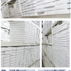 Stacks of white DIY cluster eyelash extensions boxes and product packaging