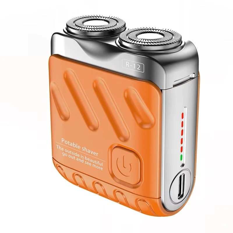 An orange and silver portable shaver with a removable head is shown.
