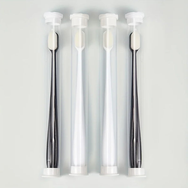 Three clear tubes of ultra-soft microbristle toothbrushes with white handles displayed vertically.
