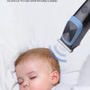 A baby is sleeping while a professional rechargeable electric hair clipper is used to cut their hair.
