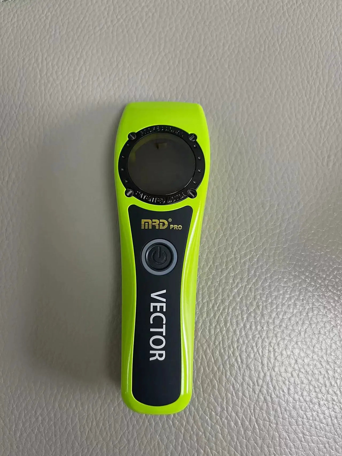 A bright lime green professional electric hair trimmer with a black housing and a power switch.