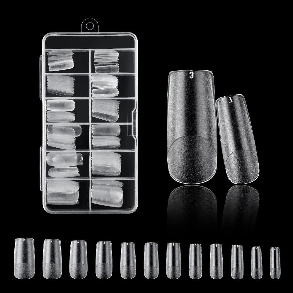 A collection of frosted French false nails in various natural finishes displayed in a clear plastic case and loose.