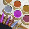 A set of holographic chrome nail glitter powder colors displayed in white containers and alongside long, pointed nail applica