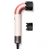 Professioneller Föhn mit Roségold-Finish und schwarzer Düse vor weißem Hintergrund.