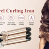 A woman holds a professional triple barrel curling iron with gold and black accents.