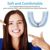A young woman smiling while holding a U-shaped toothbrush head for cleaning teeth.