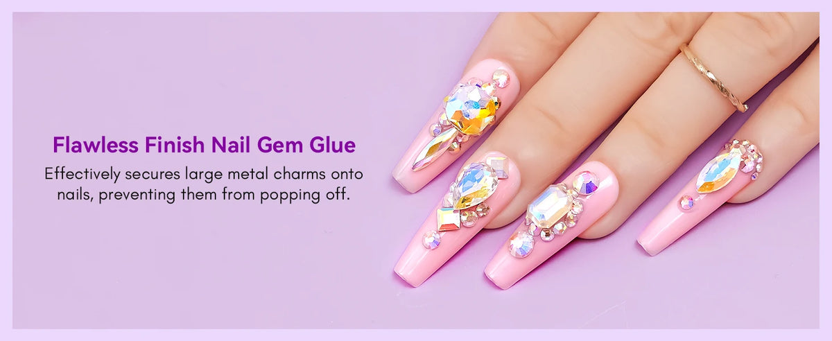 A hand displays nails decorated with large metal charms secured by flawless nail gem glue.