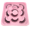 A pink tray containing a set of artificial mink eyelashes for eye extensions.