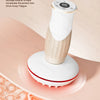 A white electric meridian brush device is shown with a textured head, resting on a pink background with translucent spheres.