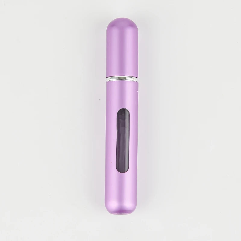 A sleek, cylindrical portable refillable perfume bottle in a glossy lilac or purple color.