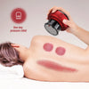 A hand applies one-key pressure relief to a person's shoulder with a red electric cupping massager.