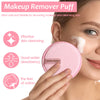 A pink makeup remover puff is shown being used on a woman's face for skin cleansing.