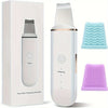 A white face skin cleansing scrubber device shown in its box and disassembled form with silicone cleaning heads.