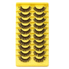 A yellow plastic tray holding multiple rows of black false eyelashes.