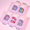 Una colección de cinco cajas de uñas postizas prensables de 120 piezas en varios colores y diseños.