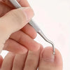 A hand is using a stainless steel ingrown toenail pedicure tool to manipulate a toenail.