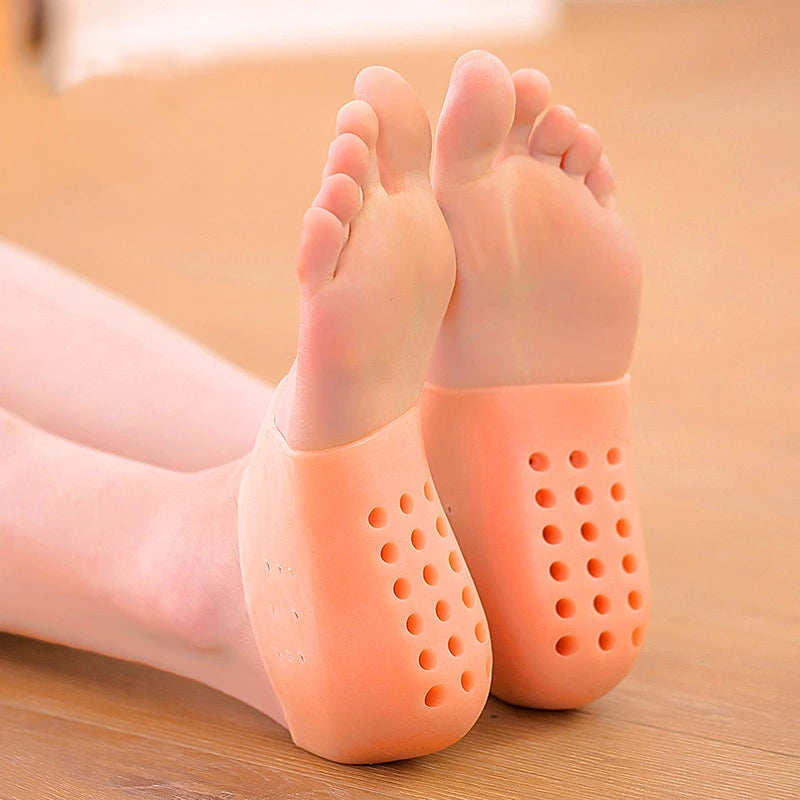 Pads en silicone couleur pêche pour talon, montrant un produit d'élévation invisible.