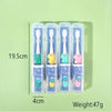 A set of five cartoon dinosaur toothbrushes in various colors packaged in clear tubes.