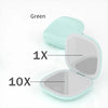 A green compact LED makeup mirror showing 1X and 10X magnification settings.