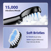 Close-up of a black electric toothbrush with soft bristles generating a foam spray.