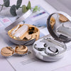 A round marble pattern contact lens storage box with a silver and gold design is shown open on a white background.