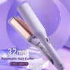 A white automatic hair curler with a rose gold barrel is shown against a purple background.