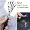 Stainless steel telescoping back massager shown being held and fitting into a pocket.