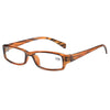 A pair of tortoiseshell-framed reading glasses with clear lenses and gold accents.