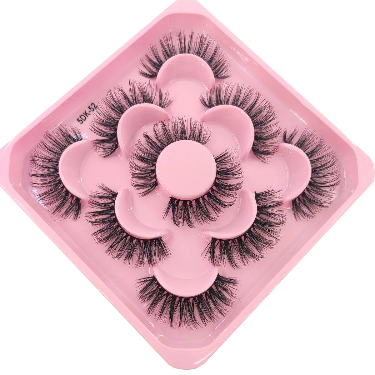 A pink plastic tray holding a set of black artificial mink eyelashes.