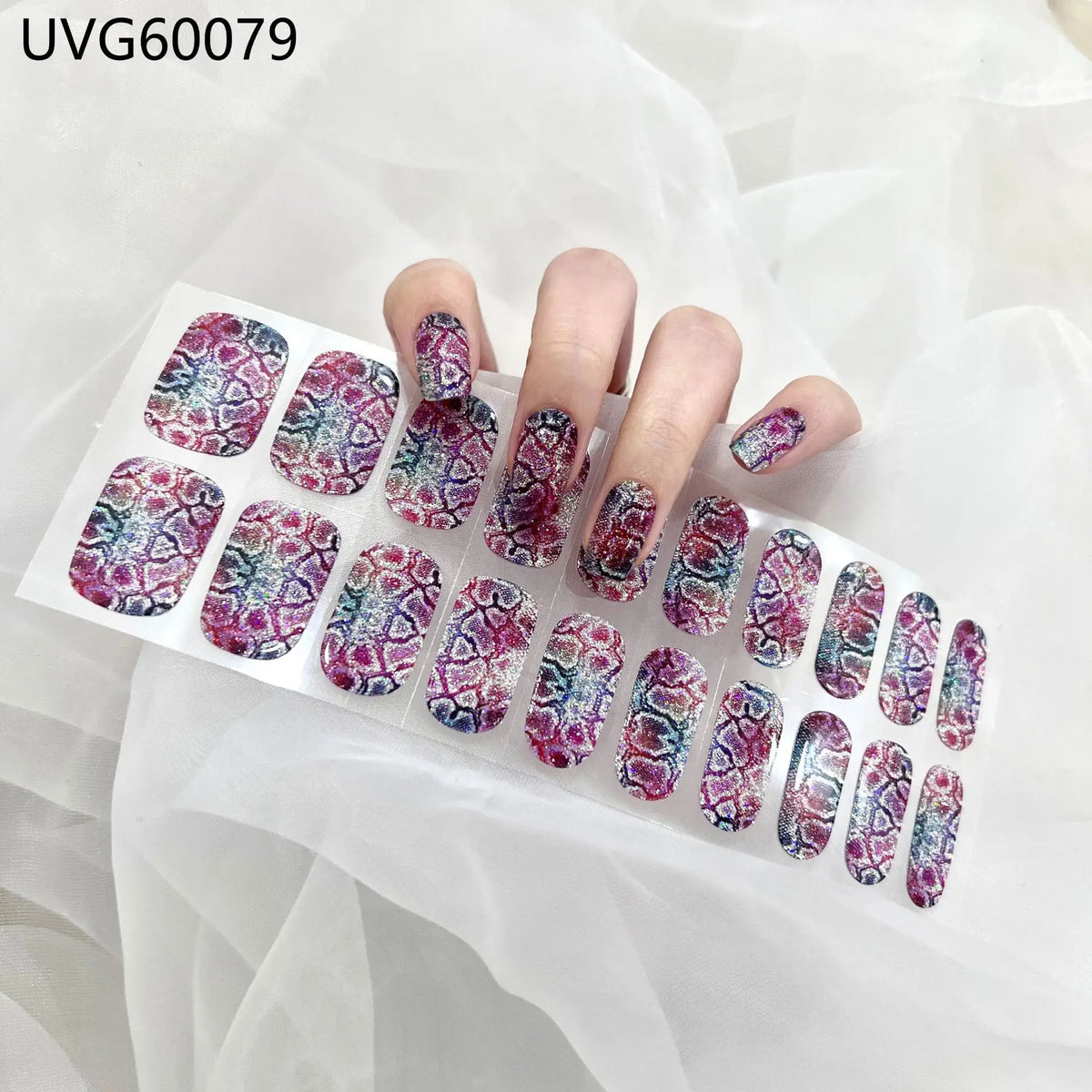 UV gel nail stickers featuring purple and blue iridescent floral designs applied to fingernails.