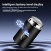 A close-up view of a black electric shaver with a digital display showing 100% battery level.