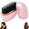 A pink portable cordless hair straightener with black barrel attachments shown next to a model's hair.