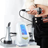 A hand is using an ultrasonic body sculpting device on a person's abdomen.