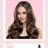 A woman with long, wavy brown hair is shown using a professional automatic rotating ceramic hair curler.