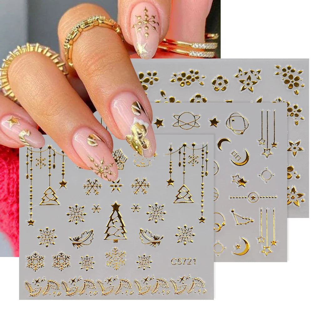 Close-up of a hand applying gold star nail art stickers onto an acrylic nail
