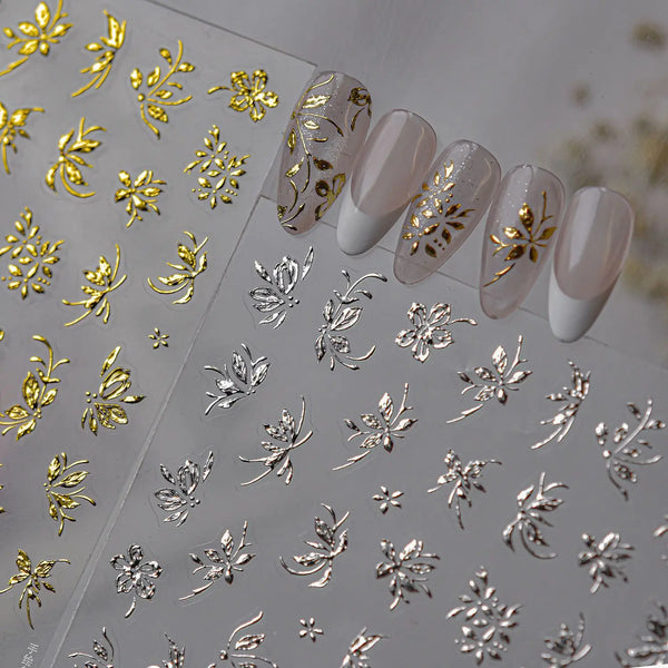 Luxury metallic flower nail art stickers featuring gold and silver designs on clear sheets