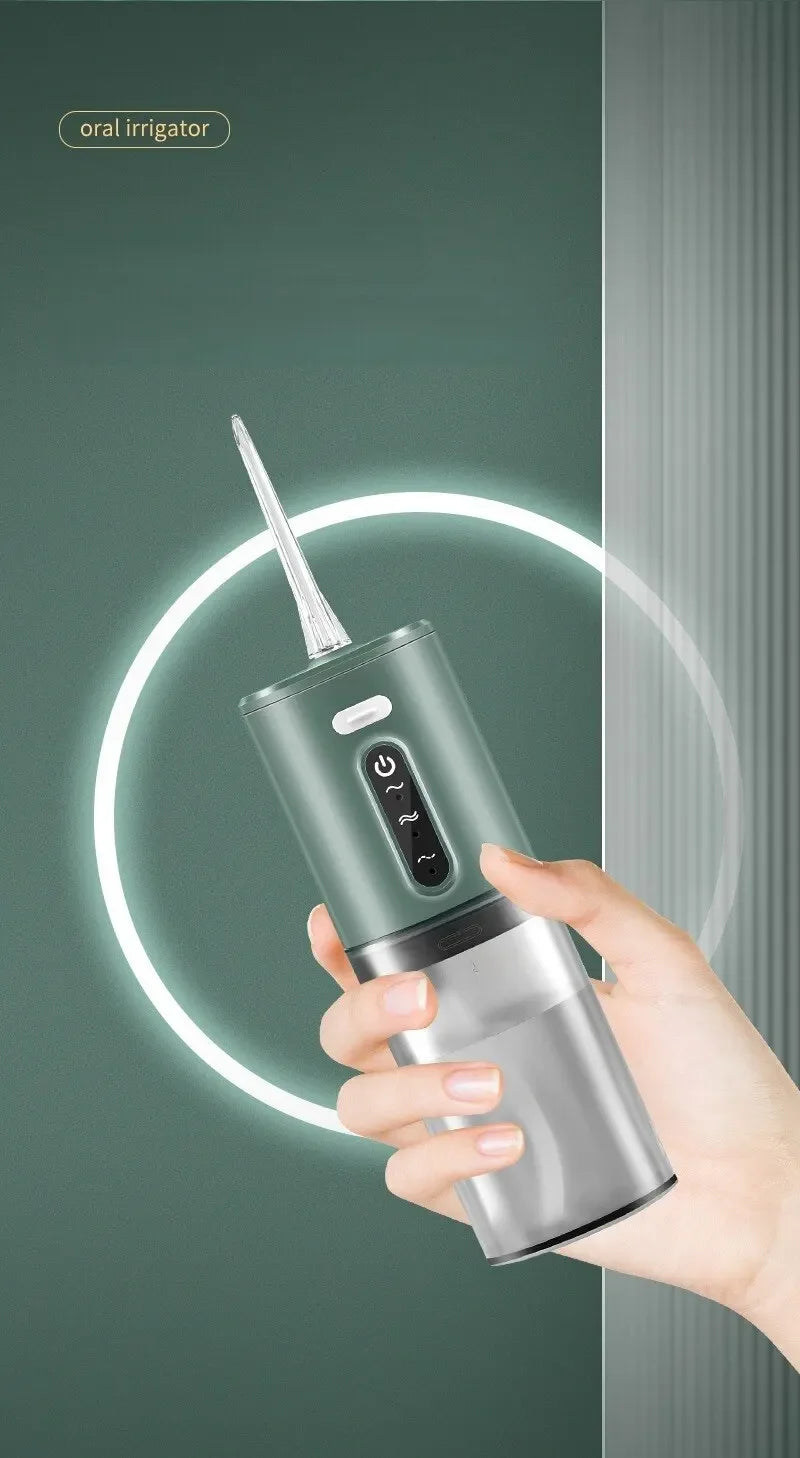 A hand holds a silver oral irrigator device with a white tip, demonstrating its use for deep cleaning.